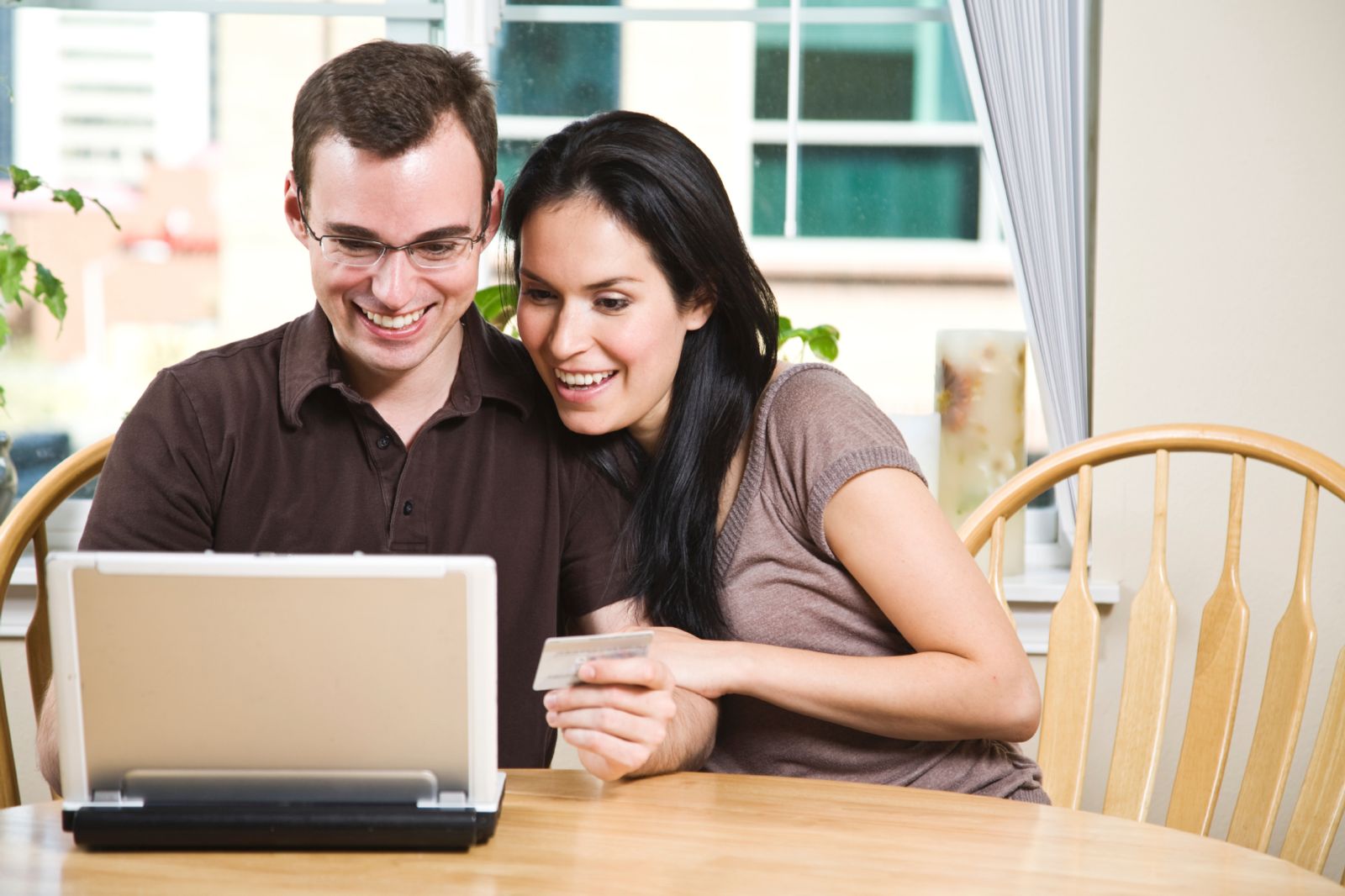 Young couple looking at laptop